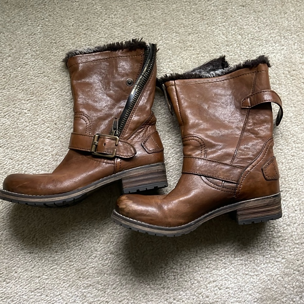 Clark’s brown boots.
